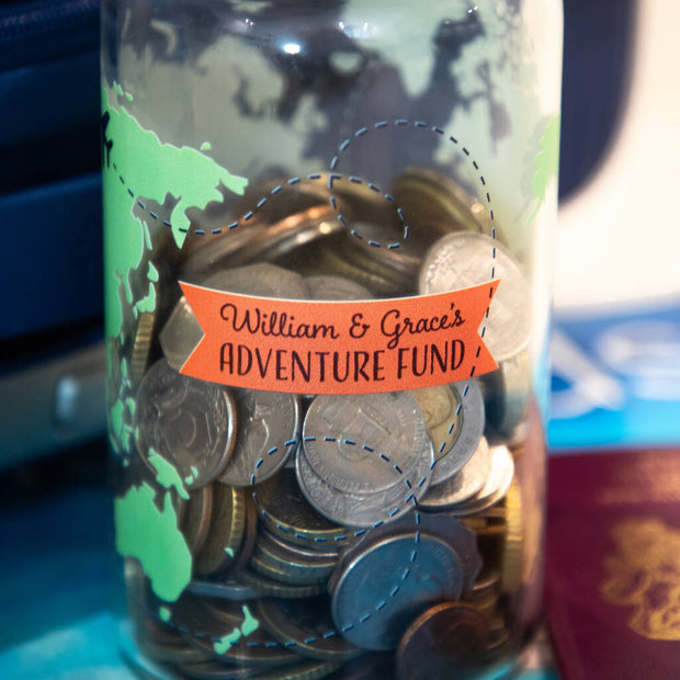Closeup of personalised adventure fund glass storage jar