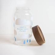 Empty rainy day glass jar with wooden lid